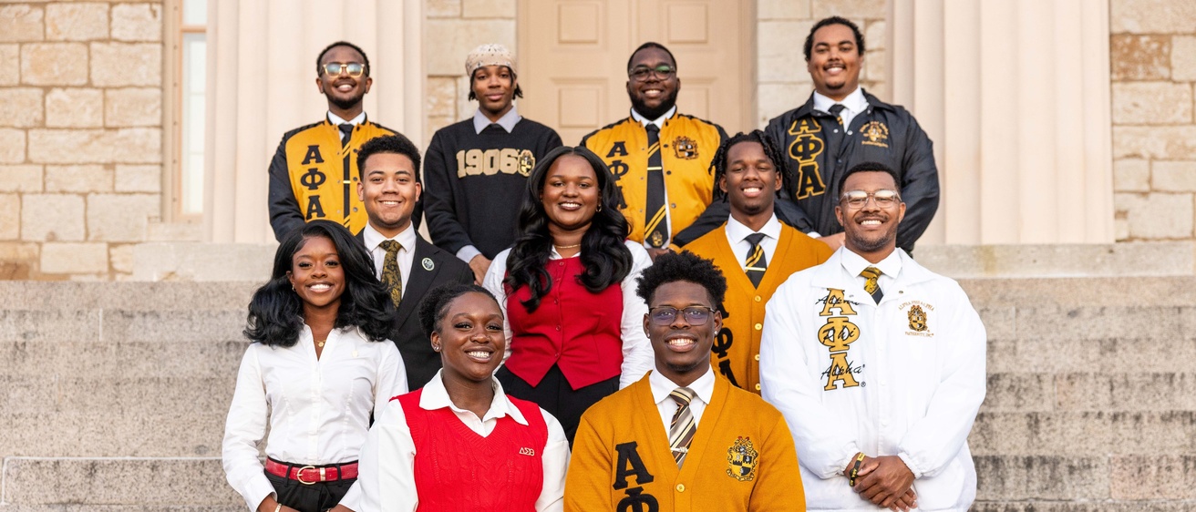 Photo of students posing on the Capitol steps.