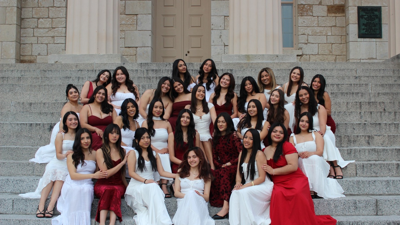 Members of Lambda Theta Nu sorority posing on the Old Capitol steps.